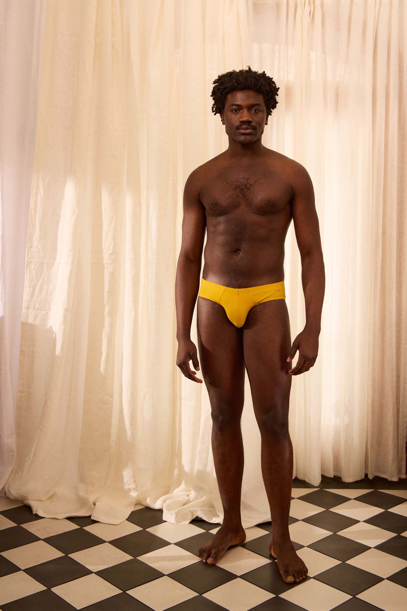 The Slip-on Swim Brief in Ochre Yellow