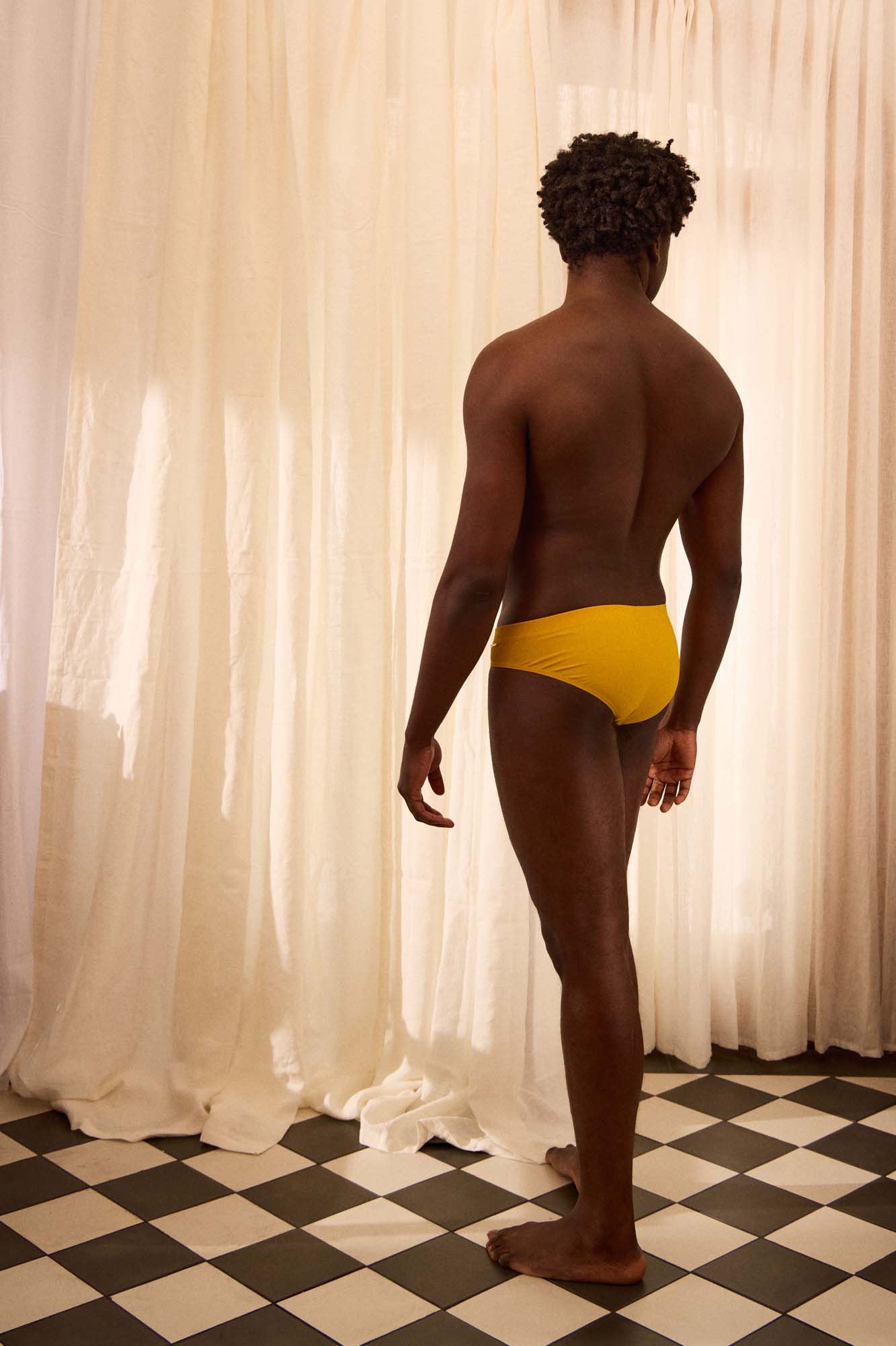 The Slip-on Swim Brief in Ochre Yellow